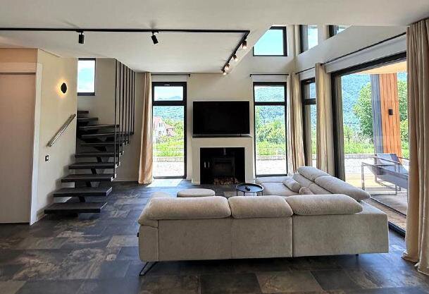 Living room with fireplace and staircase